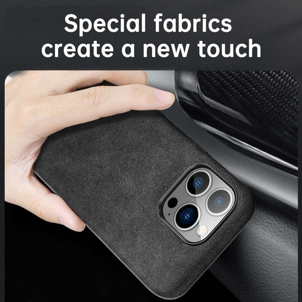 Person holding an Italian Alcantara iPhone Case showcasing premium fabric design and camera cutout.