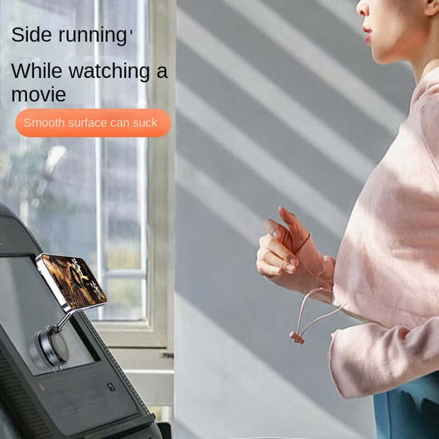 Magnetic Car Phone Holder in use, securely mounted while watching a movie on a treadmill.
