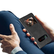 Samsung Fold Leather Case held by a person, showcasing its stylish design and protective features.